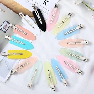 Set of 15 colorful seamless hair clips in pastel and glitter finishes for makeup