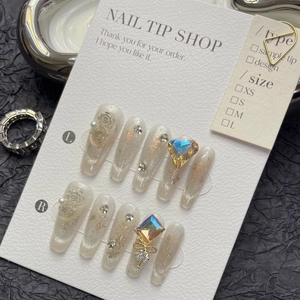 Luxury cat eye press-on nails with 3D embossed flowers and sparkling crystals