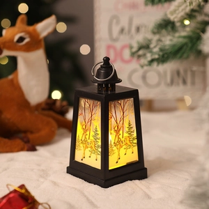 Detail of Christmas lantern with warm LED light and reindeer illustration on panels