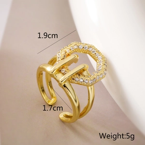 Detail shot of golden 18K gold-plated geometric ring with white zircon measurements