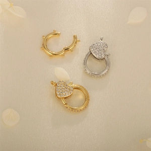 Luxurious gold and silver heart-shaped spring clasps with zircon micro-pave on silk fabric