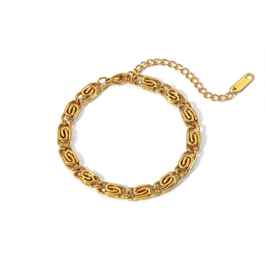 Macro shot of 18K gold plated stainless steel chain bracelet with S.STEEL hallmark