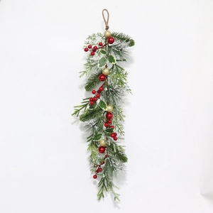Christmas teardrop swag with pine needles, red berries, and gold baubles on white background