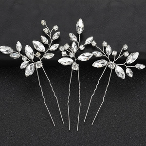 Three-piece silver crystal hair pins featuring elegant leaf and flower designs on black background