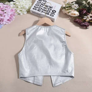 Flat lay of sleeveless metallic silver PU vest on wooden hanger with decorative flowers