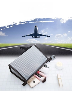 Detail of portable PVC mesh toiletry bag with large capacity for travel cosmetics