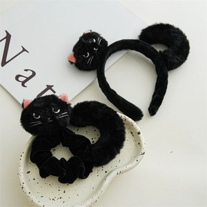 Detail of plush black cat ear headband and velvet scrunchie set for Halloween hair styling