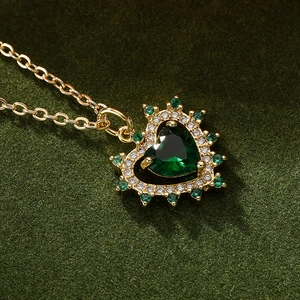 Elegant gold heart pendant necklace with green zircon gemstone and fine gold chain