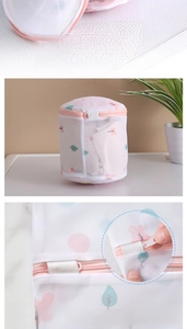 Detail of cylindrical laundry bag with fine mesh and hidden zipper for bra protection