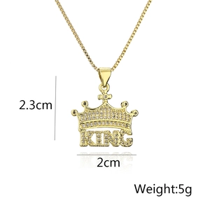 Macro shot of gold plated king crown pendant showing 2.3cm height and 2cm width details
