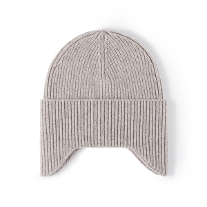 Thick light grey knitted winter beanie with earflaps and warm ribbed texture