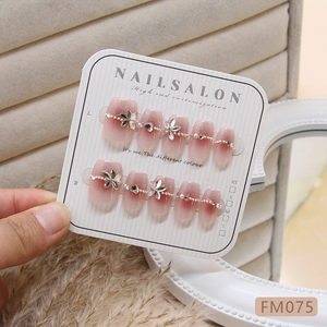 Pink gradient press-on nails with 3D alloy flowers, crystals and pearls on display card