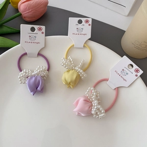 Set of three colorful tulip flower hair ties with pearls in purple yellow and pink