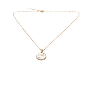 Detail of gold shell pendant with white Eye of Horus enamel on a delicate link chain
