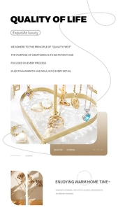 Golden heart-shaped jewelry tray with white textured base for rings and necklaces