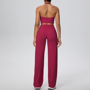 Detail of high-waisted wide-leg yoga trousers and halter neck backless sports top