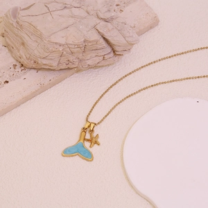 Gold stainless steel necklace featuring a blue whale tail and a gold starfish pendant