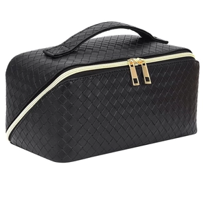 Large black woven texture makeup bag with top handle and gold double zippers
