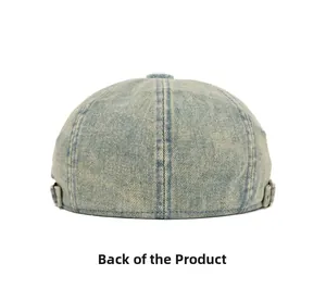 Back view of vintage washed denim beret with adjustable metal buckle detail