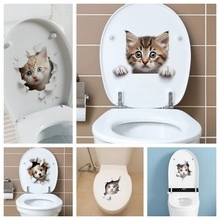 Detail of cute cat and dog 3D stickers applied on bathroom toilet seat covers