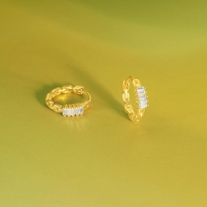Macro view of S925 sterling silver hoop earrings with square zircon and S925 hallmark