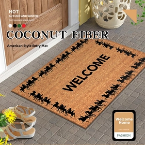 Détail du paillasson en fibre de coco avec motif carrosse vintage et lettrage noir