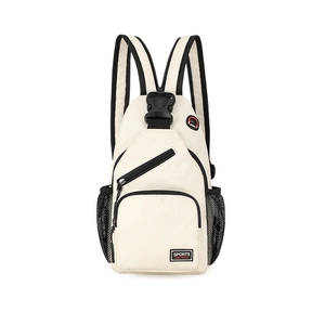 Detail of off-white canvas backpack featuring black zippers and mesh side pocket