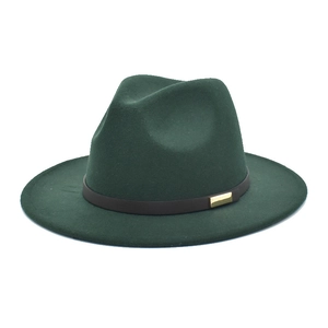 Detail view of dark green wool fedora with brown band and golden buckle accent