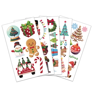 Detail view of 5 vibrant Christmas temporary tattoo sheets with snowmen and reindeers