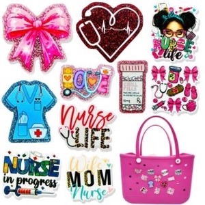 Nurse-themed glitter charms including stethoscope and uniform on a pink tote bag