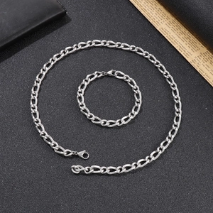 Detail of 925 stamped clasp on silver Figaro chain necklace and bracelet set