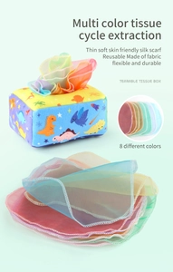 Detail of baby sensory tissue box toy with colorful scarves and dinosaur plush box