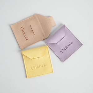 Tres bolsas de microfibra para joyas en rosa, púrpura y amarillo con cierre de solapa