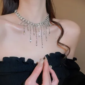Elegant silver layered tassel choker necklace with sparkling rhinestones and drop pendants