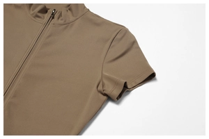 Close-up of stand collar with metal zipper on brown short sleeve yoga bodysuit