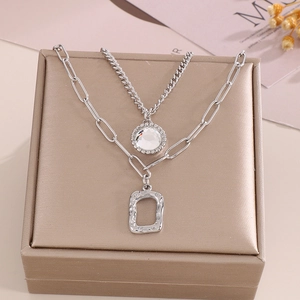Detail view of double-layer silver hip hop necklace with crystal pendant and square frame