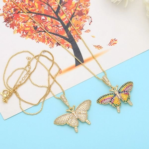 Detailed macro of gold butterfly necklaces with colorful and white zircon micro-pave