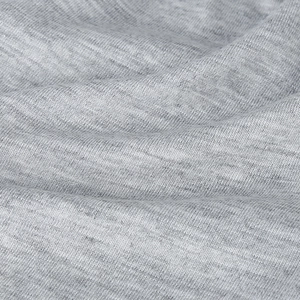 Close-up of soft heather gray knitted fabric texture with natural jersey folds