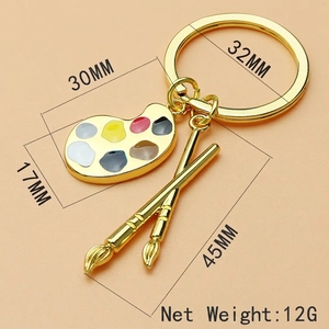 Creative gold artist palette and paintbrush keychain with colorful paint dots