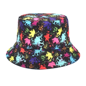Close-up of vibrant neon graffiti print on a black fabric bucket hat with white background