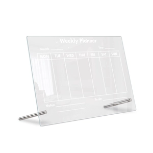 Close-up of a desktop acrylic weekly planner with metal stand for office and home use