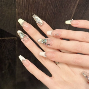 Handmade french press-on nails with cat-eye pink finish and luxury crystals on long coffin shape
