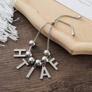 Silver snake chain bracelet with custom letter charms and adjustable sliding clasp closure