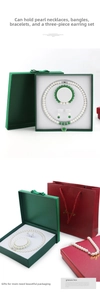 Three-piece pearl jewelry set with green pendant and matching gift box and paper bag