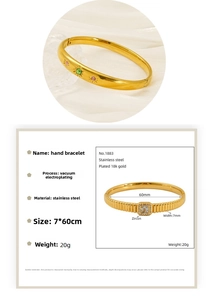 Detail view of 18k gold plated stainless steel bangles with colorful zircon inlay details