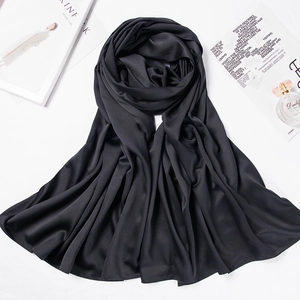 Detailed view of the soft matte satin texture and elegant drape of this solid black hijab