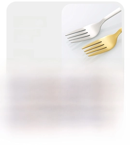 Detail of matte brushed stainless steel spoons and forks with smooth polished edges