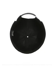 Detail view of the cotton interior structure and adjustable strap of a black docker cap