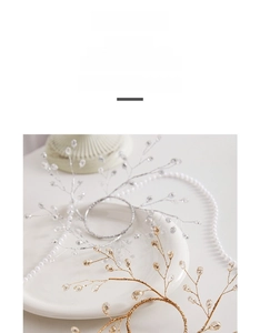Detailed view of silver and gold Christmas ornaments with beads and pearl chains