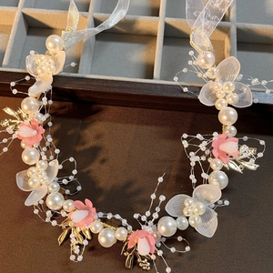 Elegant gold leaf and pearl flower headband with pink floral accents for kids and brides